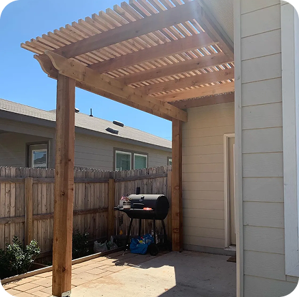 A wooden pergola over a house adds charm to new home decks, enhancing outdoor living in San Antonio, Texas.